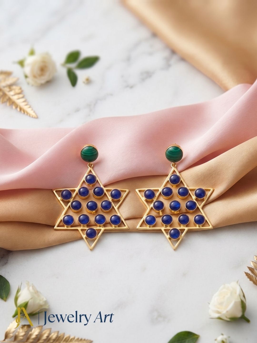 Elegant Malachite and Blue Glass earrings arranged in a premium jewelry display

