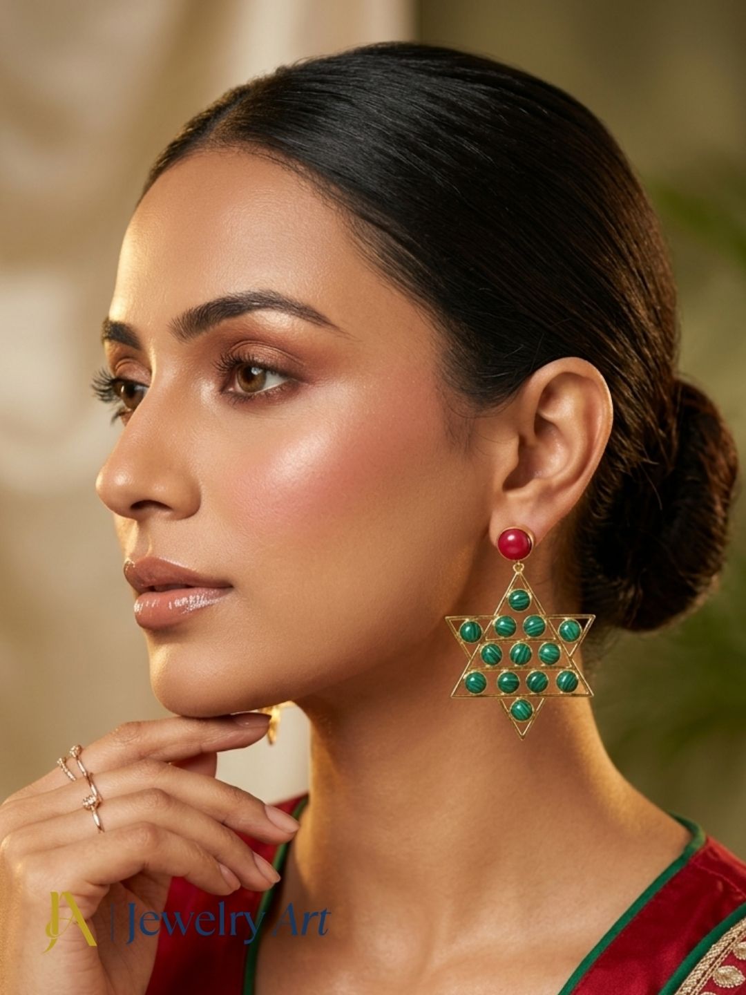 Woman wearing amazing gold plated Red Glass and Malachite astronomical star designer party wear dangle drop earrings.

