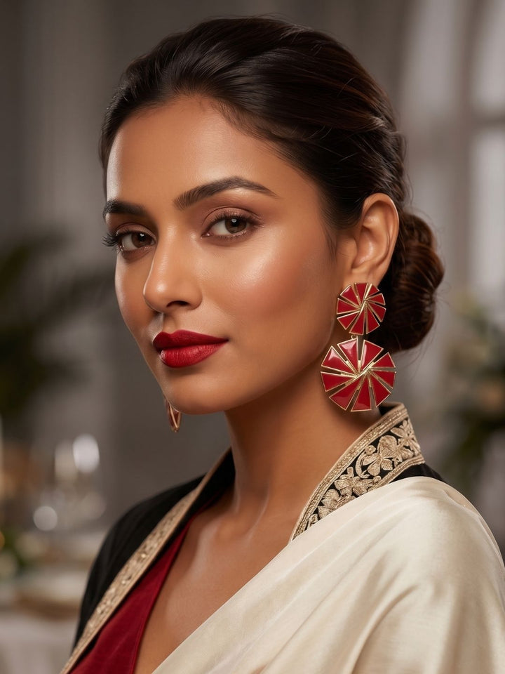 Fashion model wearing handcrafted gold plated red glass drop earrings
