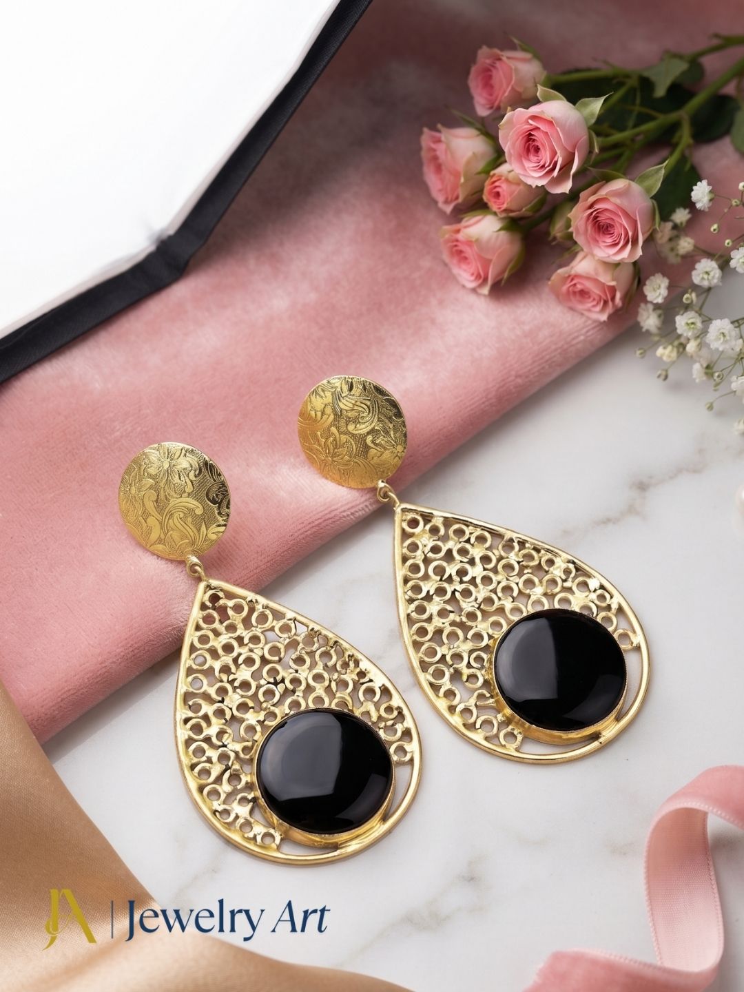 Handcrafted gold plated Black Onyx stone lightweight designer dangle drop earrings showcased in luxury decorative jewelry styling.
