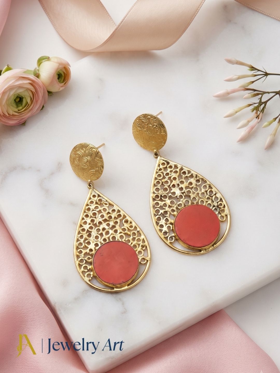 Editorial-style shoot showcasing Coral glass stone statement earrings
