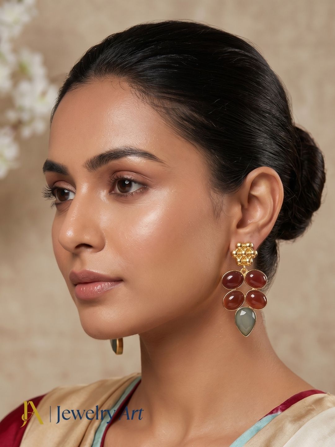 Fashion model wearing designer red onyx and aquamarine drop earrings
