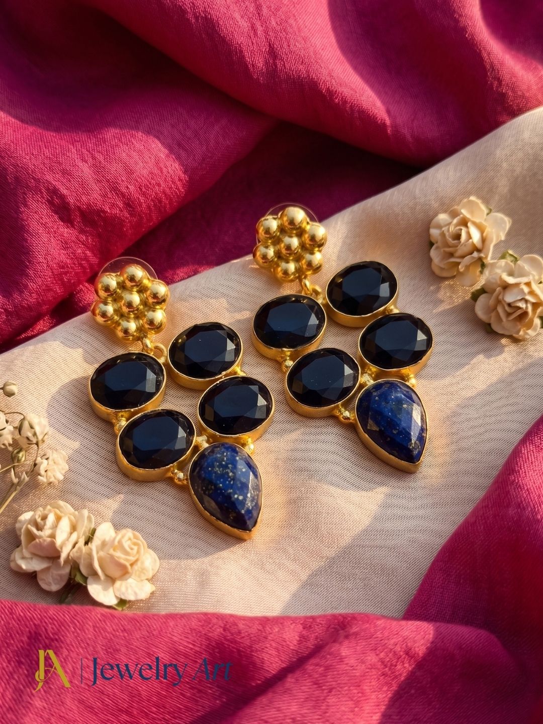 Artistic display of handcrafted blue quartz lapis dangle earrings
