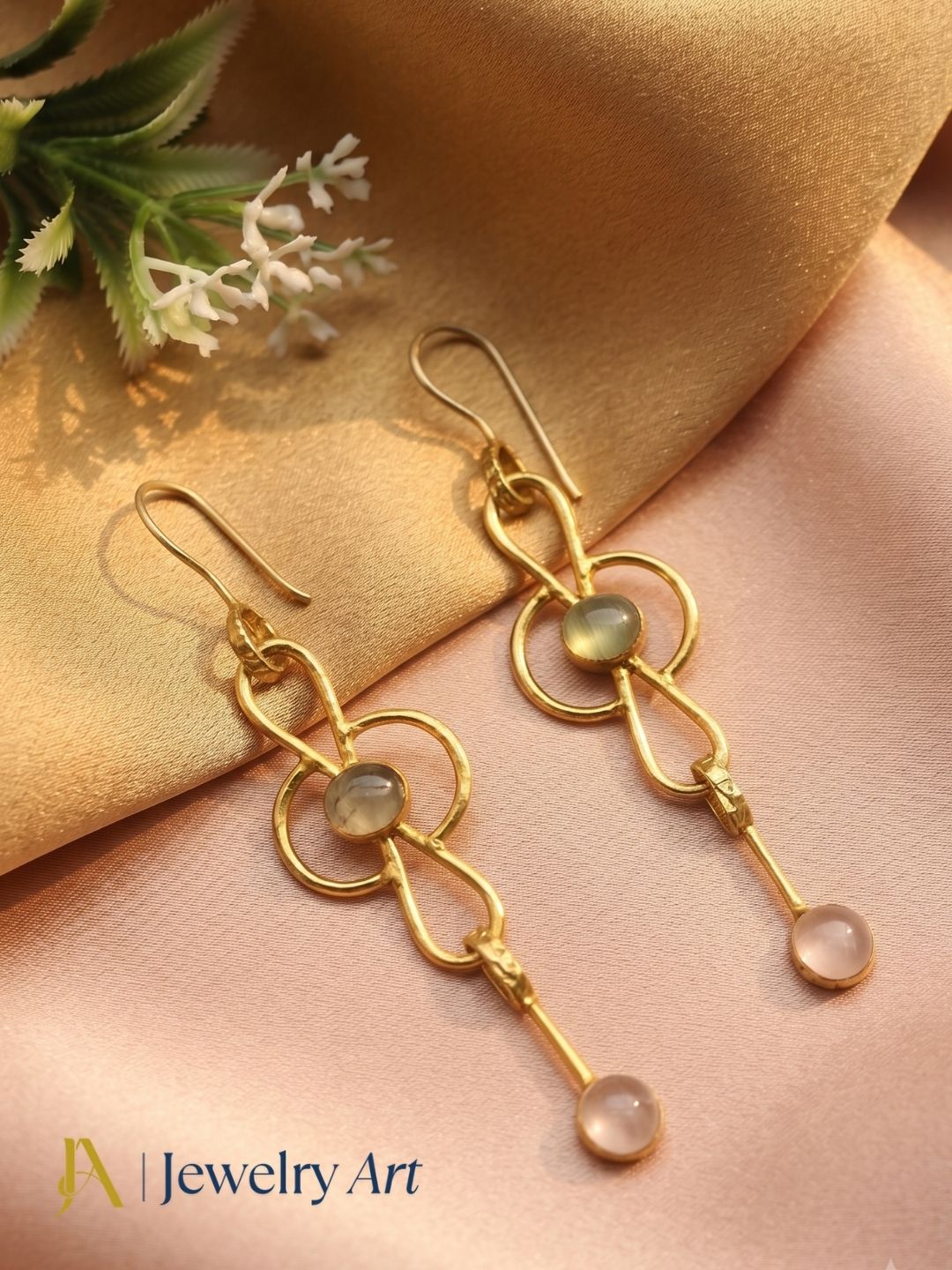 Decorative setup highlighting gold plated Prehnite Rose Quartz gemstone earrings
