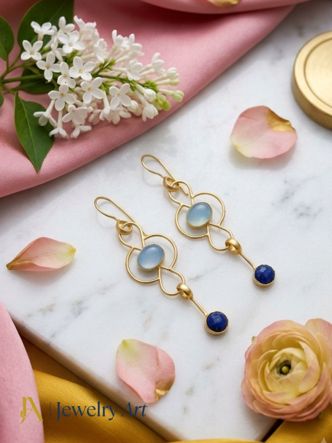 Elegant Chalcedony and Lapis earrings arranged in a premium jewelry display
