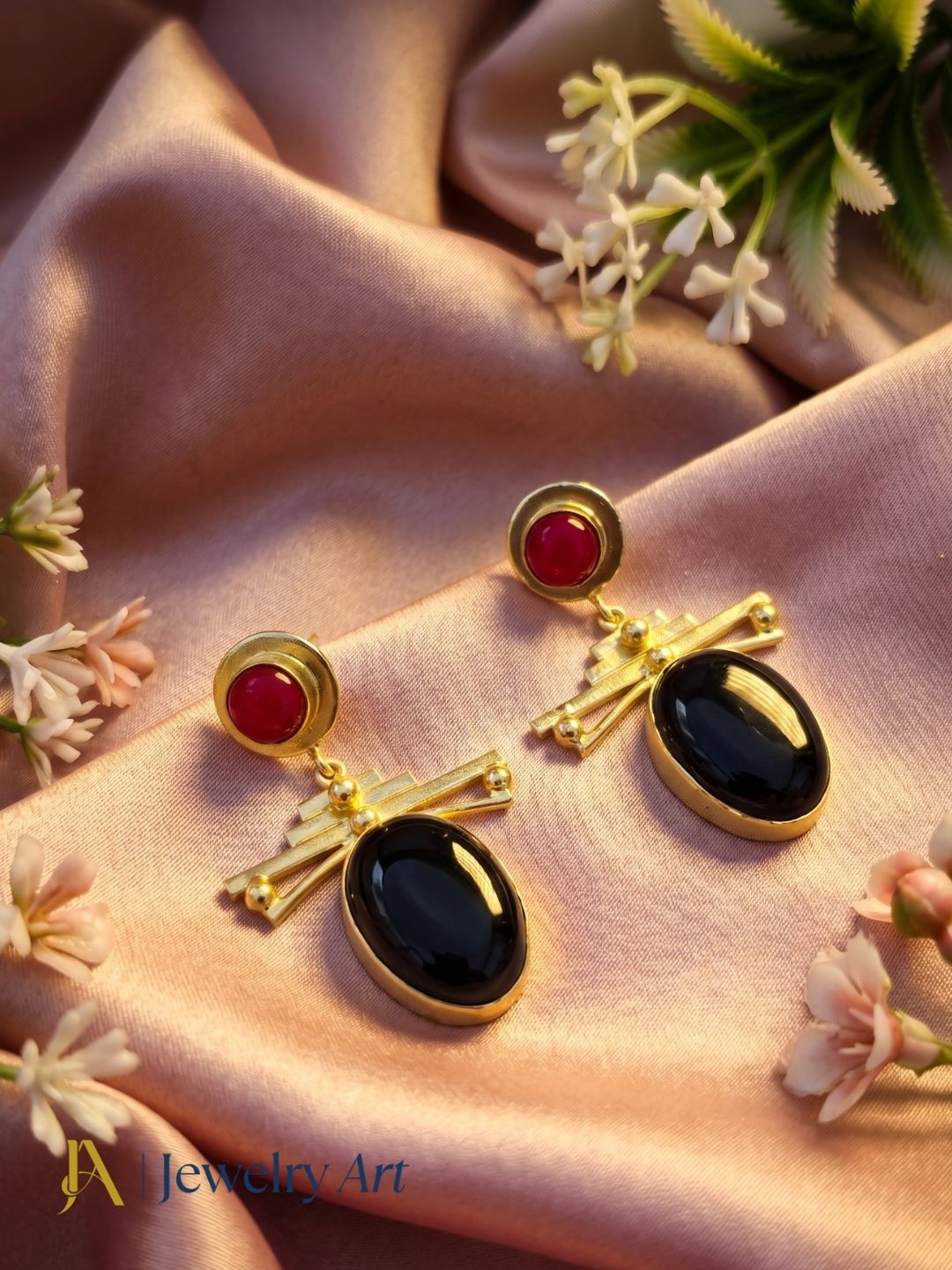 Premium gold plated gemstone earrings highlighted in decorative styling
