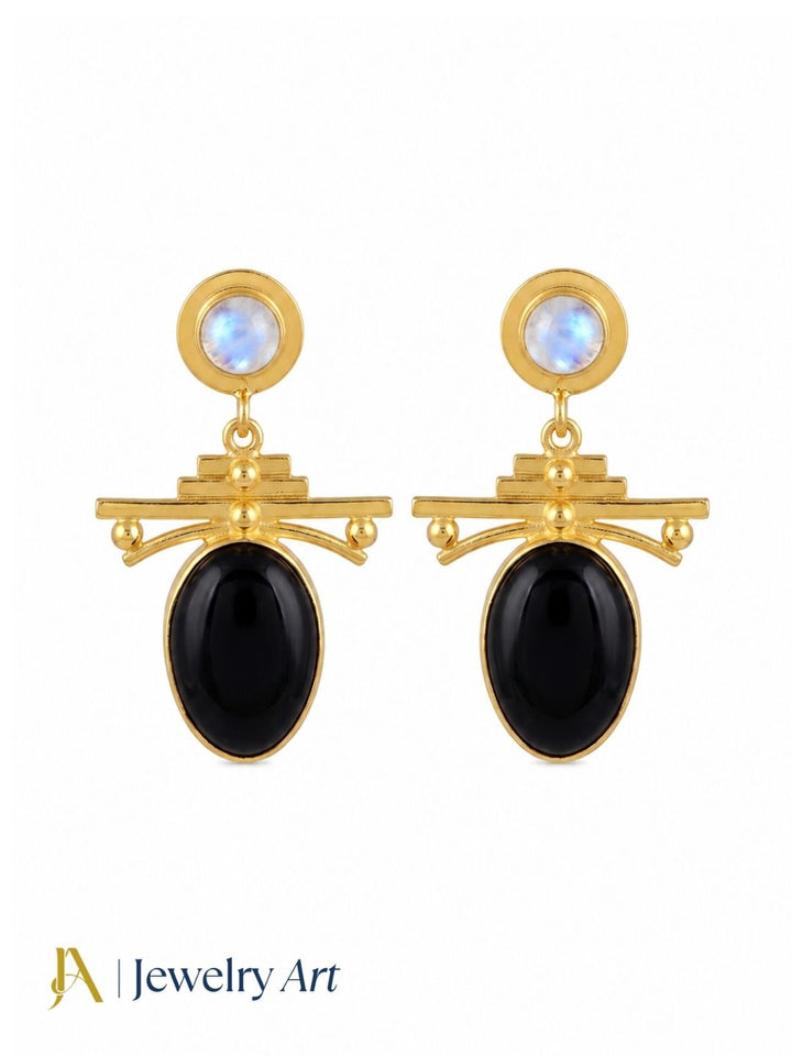 Gold plated black onyx and white rainbow stone dangle earrings on white background for women
