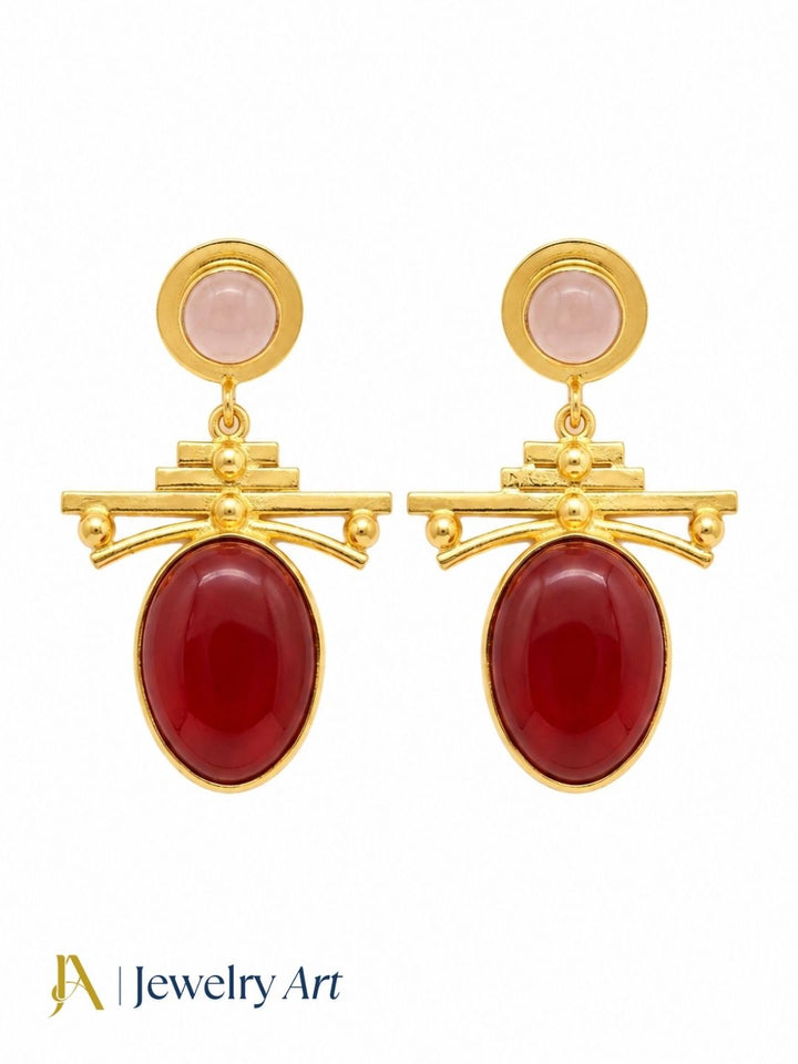 Elegant rose quartz and red onyx drop earrings displayed on white background
