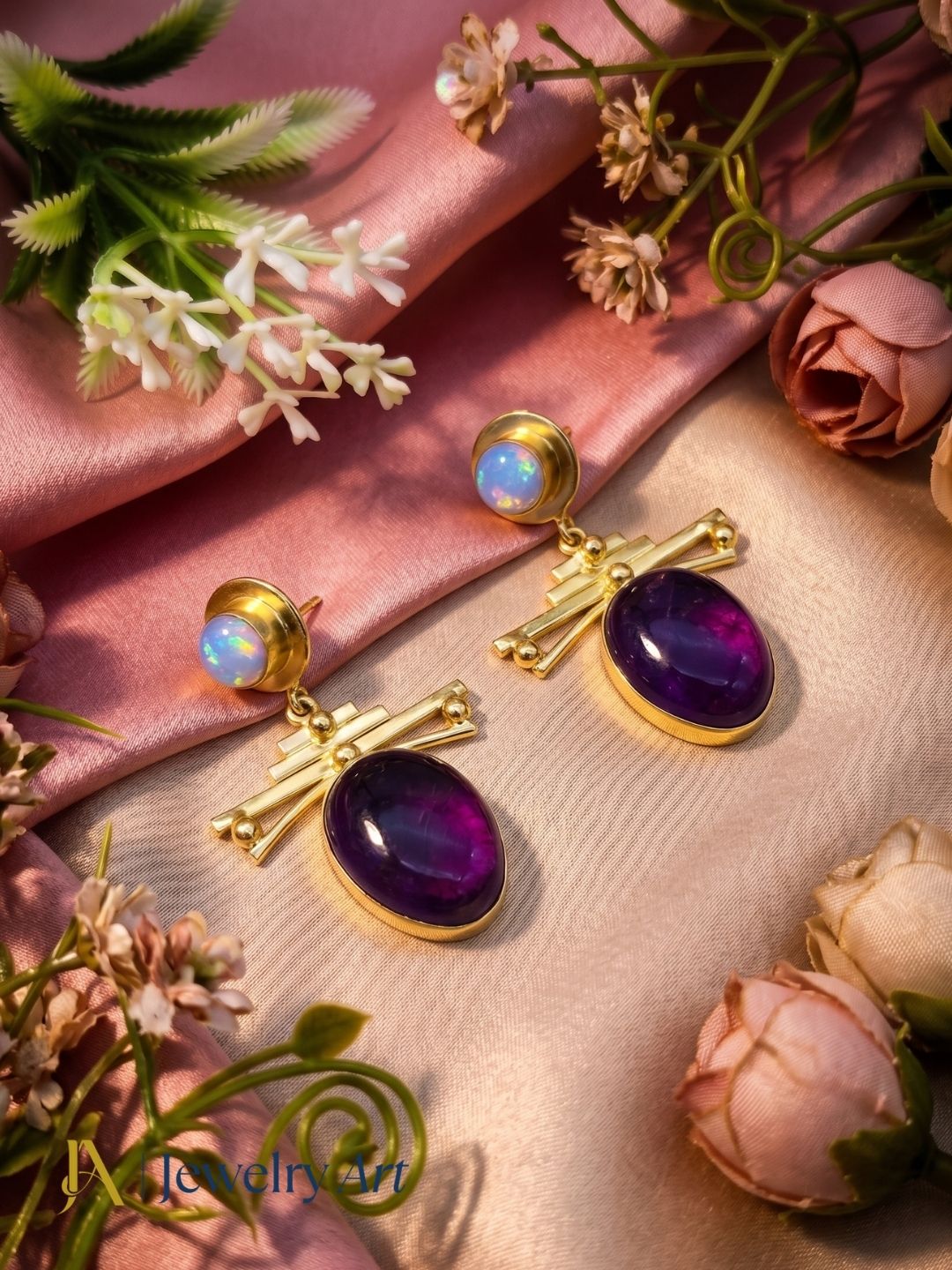 Amethyst synthetic opal gemstone earrings displayed with luxury decorative props
