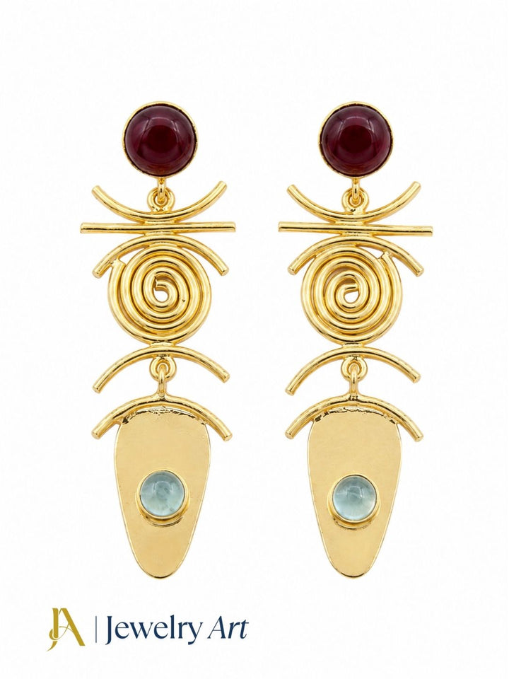 Designer red onyx aquamarine gemstone earrings on a pure white background
