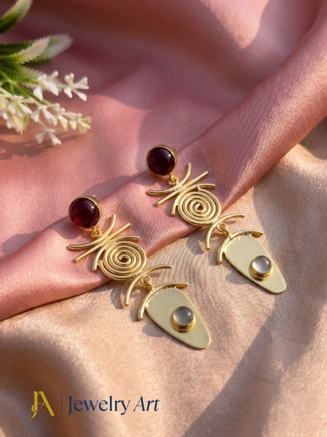 Premium gemstone earrings highlighted in decorative styling
