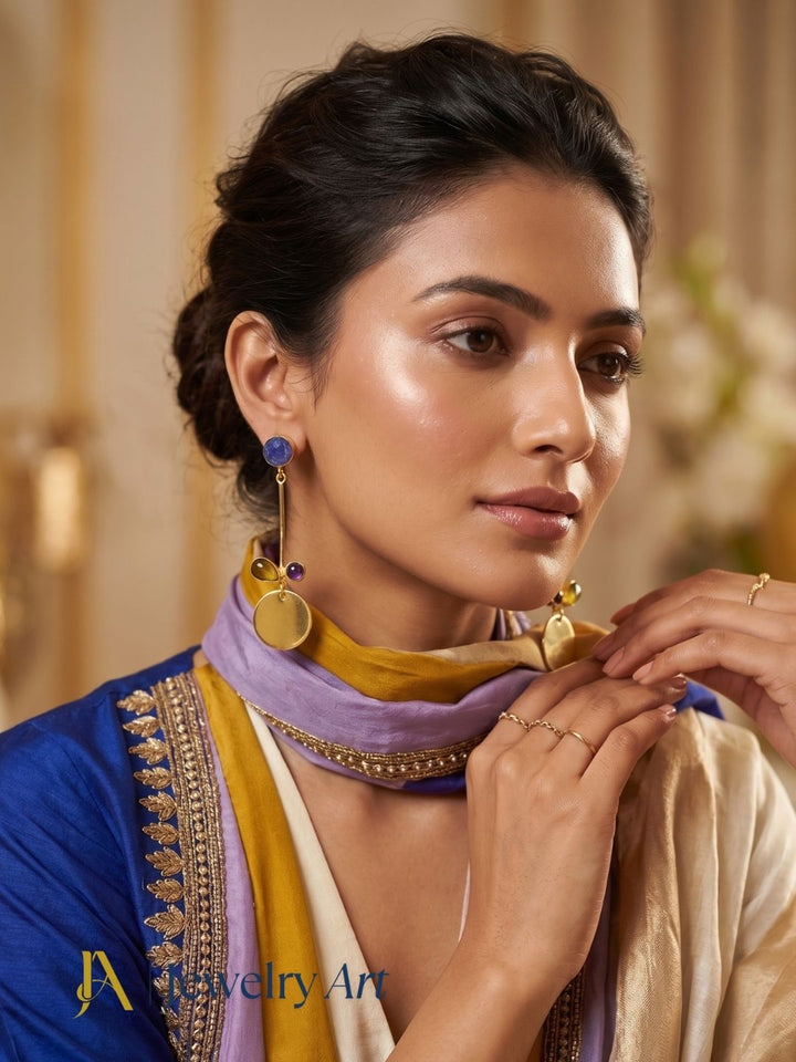 Close-up of model wearing Blue Hathipara amethyst yellow onyx earrings
