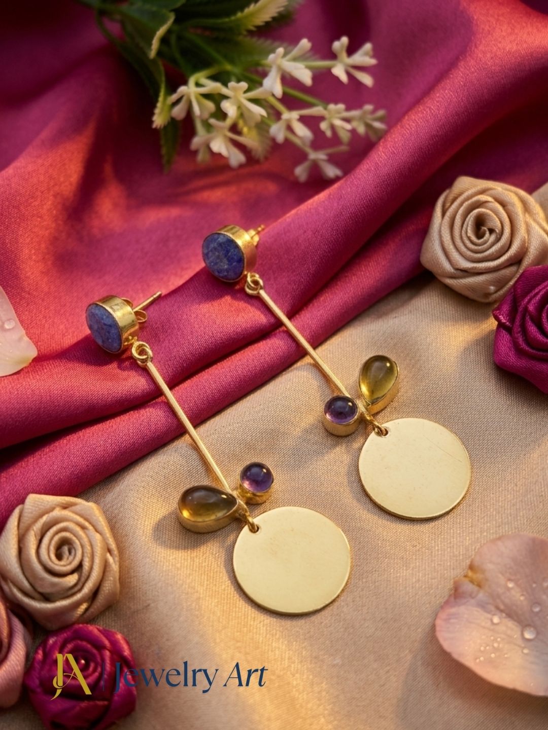 Gold plated multi gemstone earrings displayed with elegant decorative props
