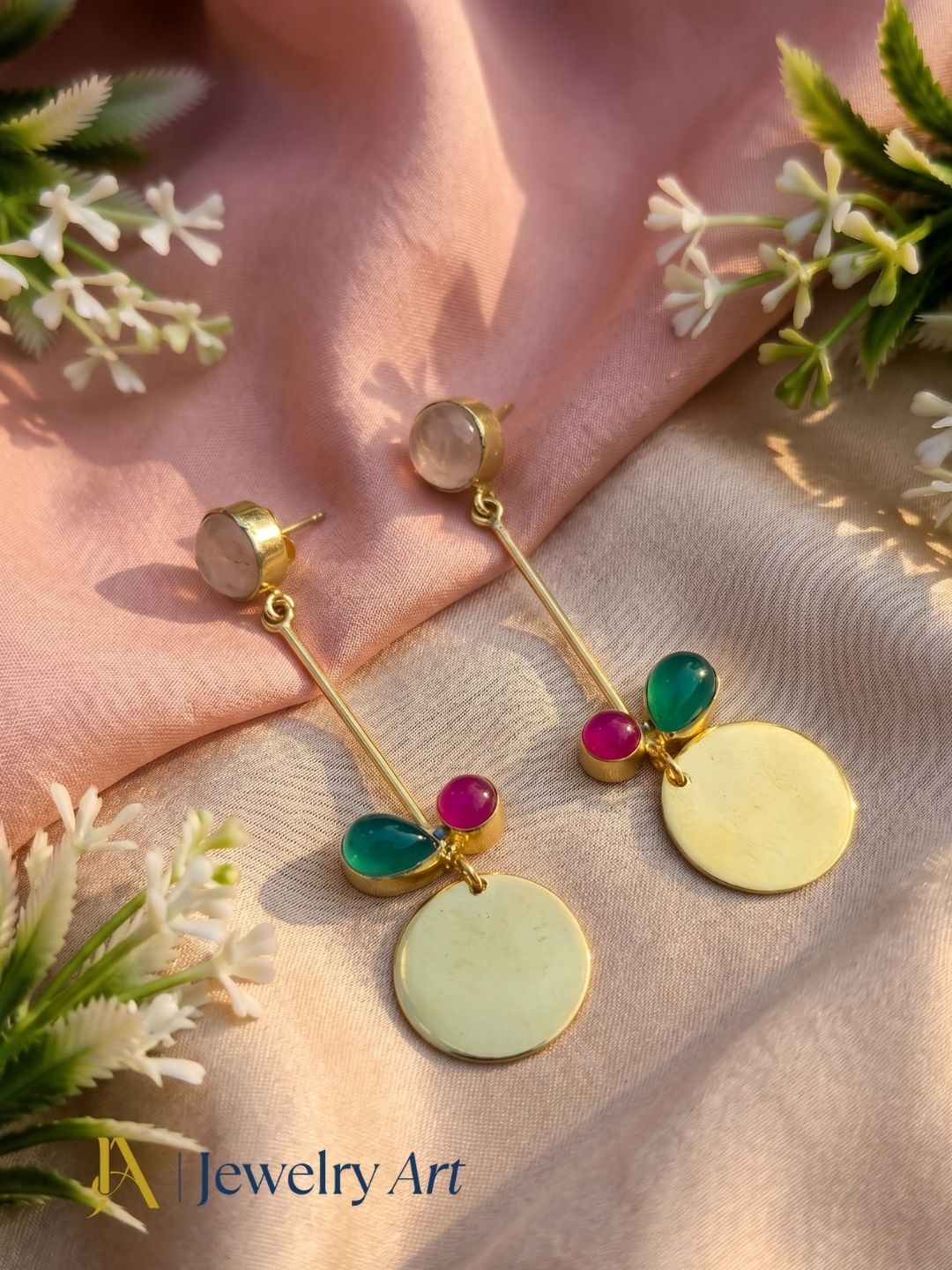 Artistic display of rose quartz, pink onyx and green onyx dangle earrings
