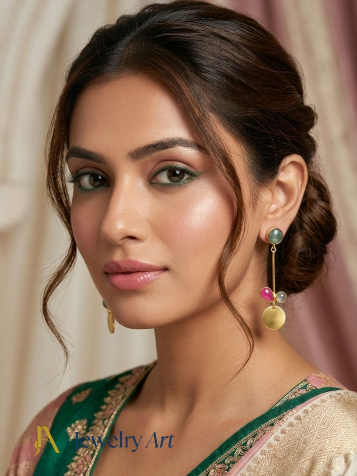Model showcasing handcrafted Green Hathipara pink onyx prehnite gemstone earrings
