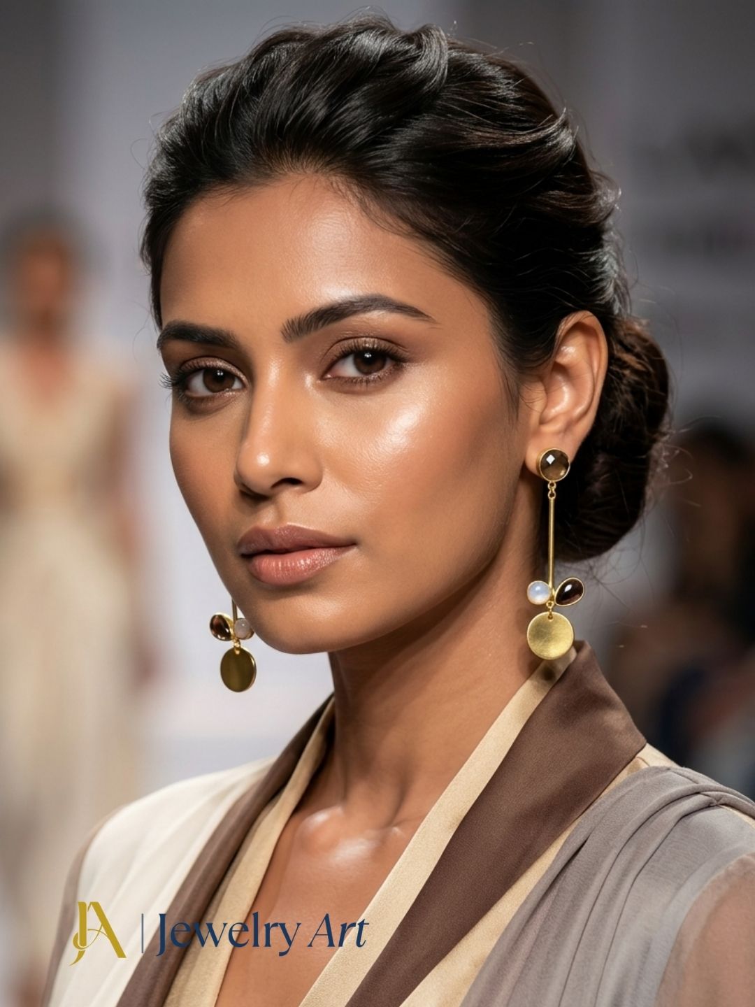 Woman wearing gold plated chalcedony, white rainbow and smoky quartz designer earrings
