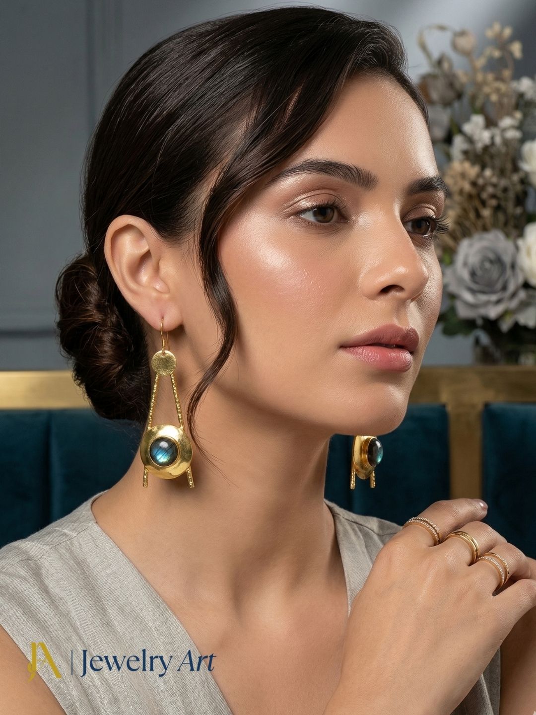 Handcrafted gold tone drop earrings with labradorite stone and polished gold finish
