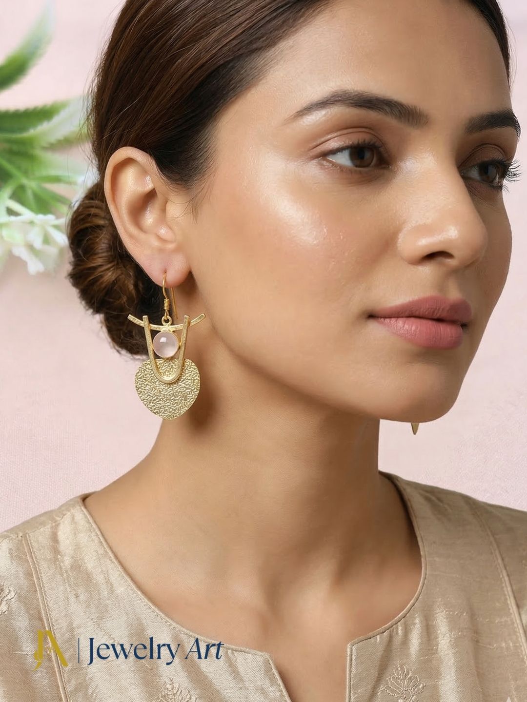 Fashion gold tone dangle earrings with hammered look and rose quartz accent
