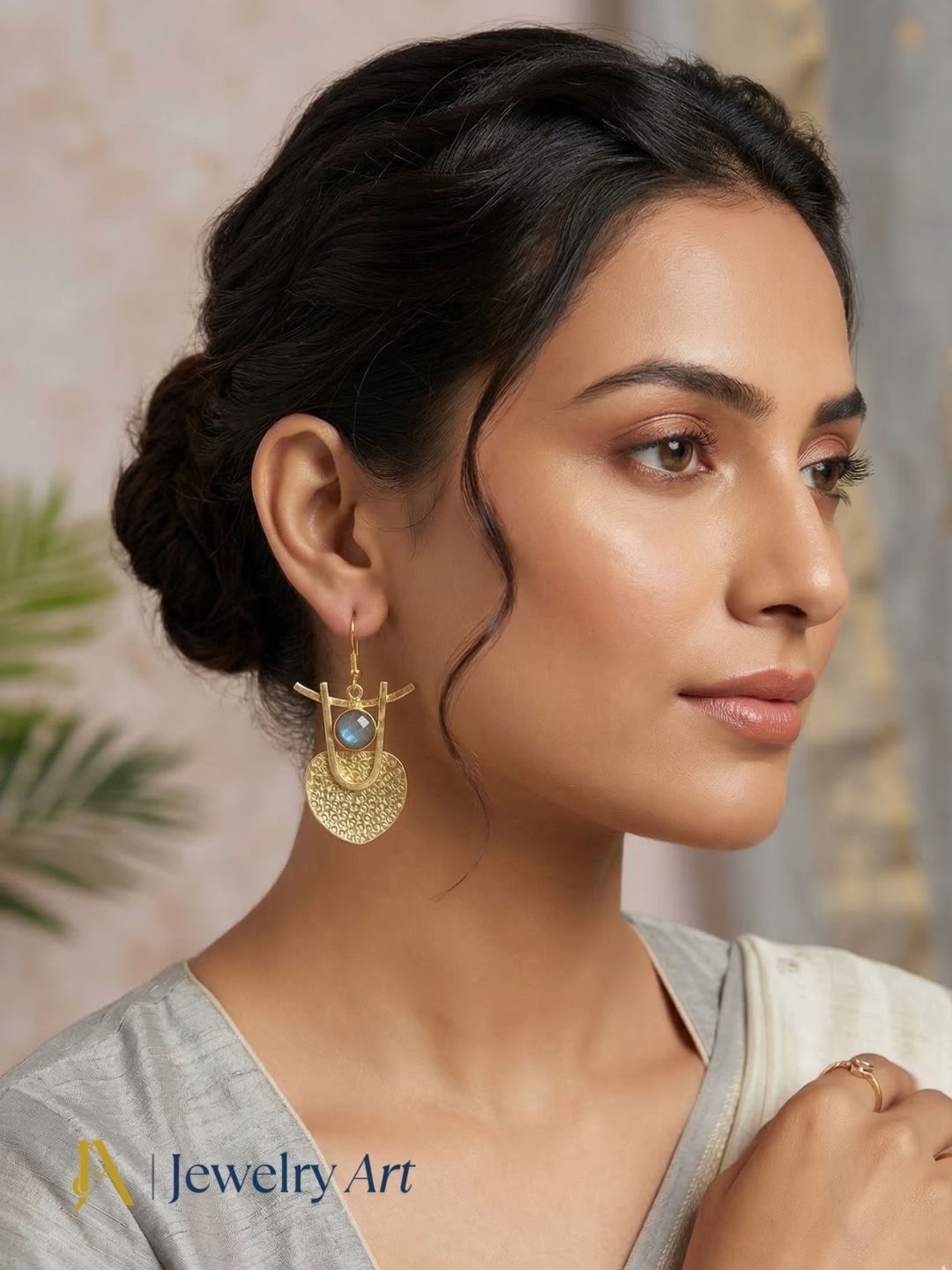 Bold statement earrings with faceted labradorite and gold tone detailing
