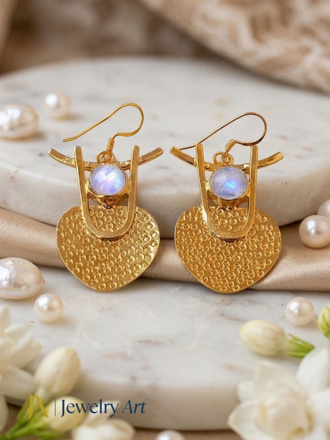 High shine gold plated earrings with white rainbow stone radiant surface
