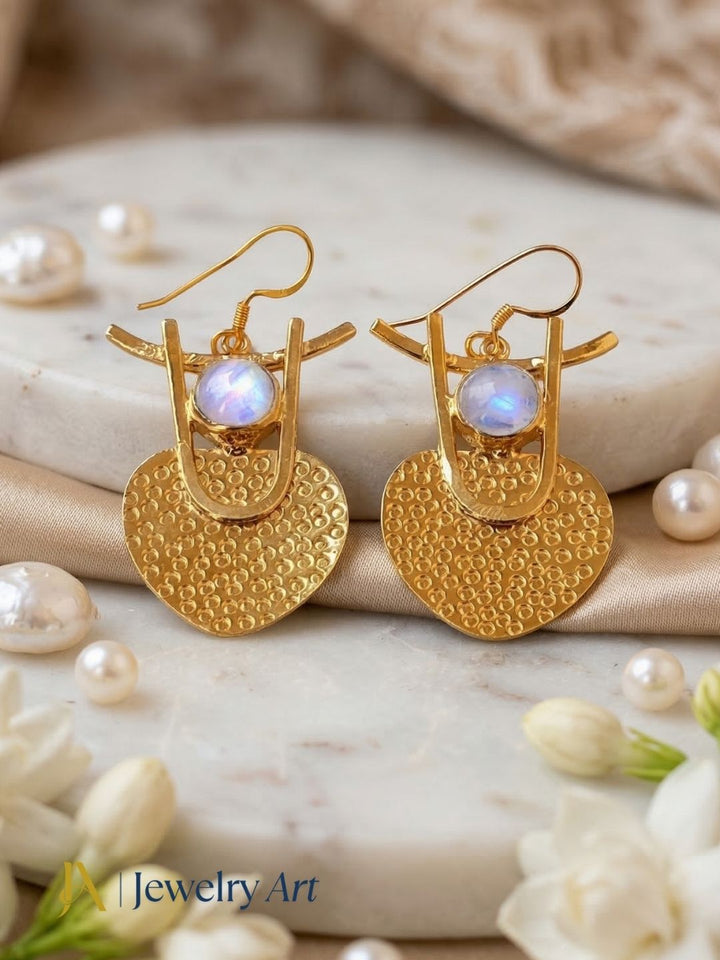 High shine gold plated earrings with white rainbow stone radiant surface
