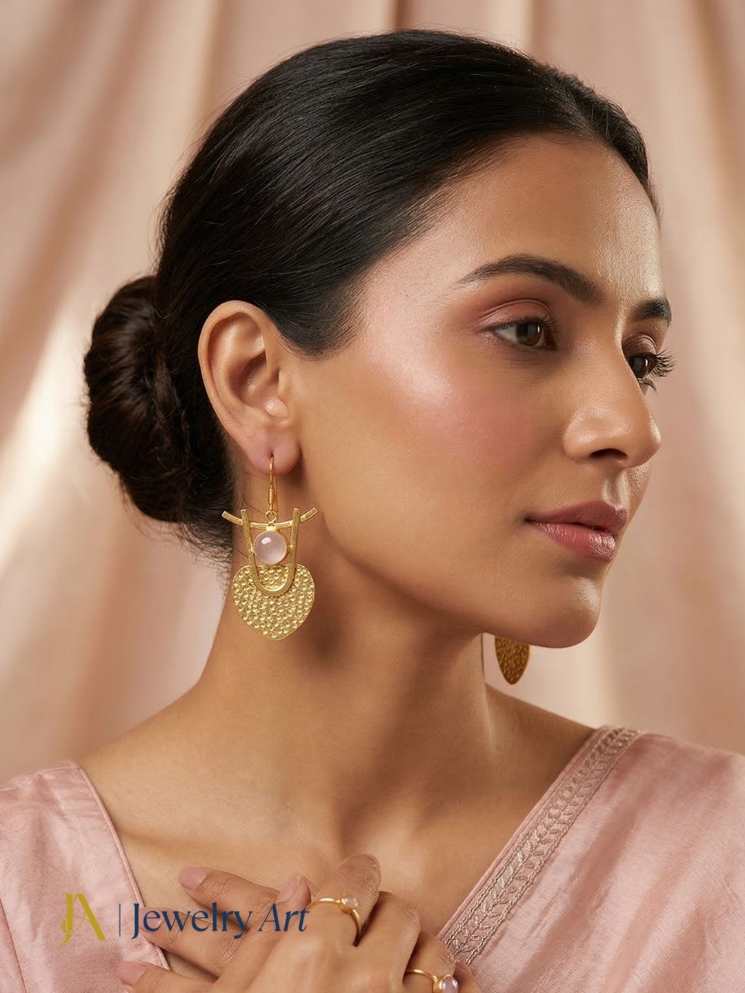 Unique gold plated earrings with rose quartz stone featuring natural pink charm
