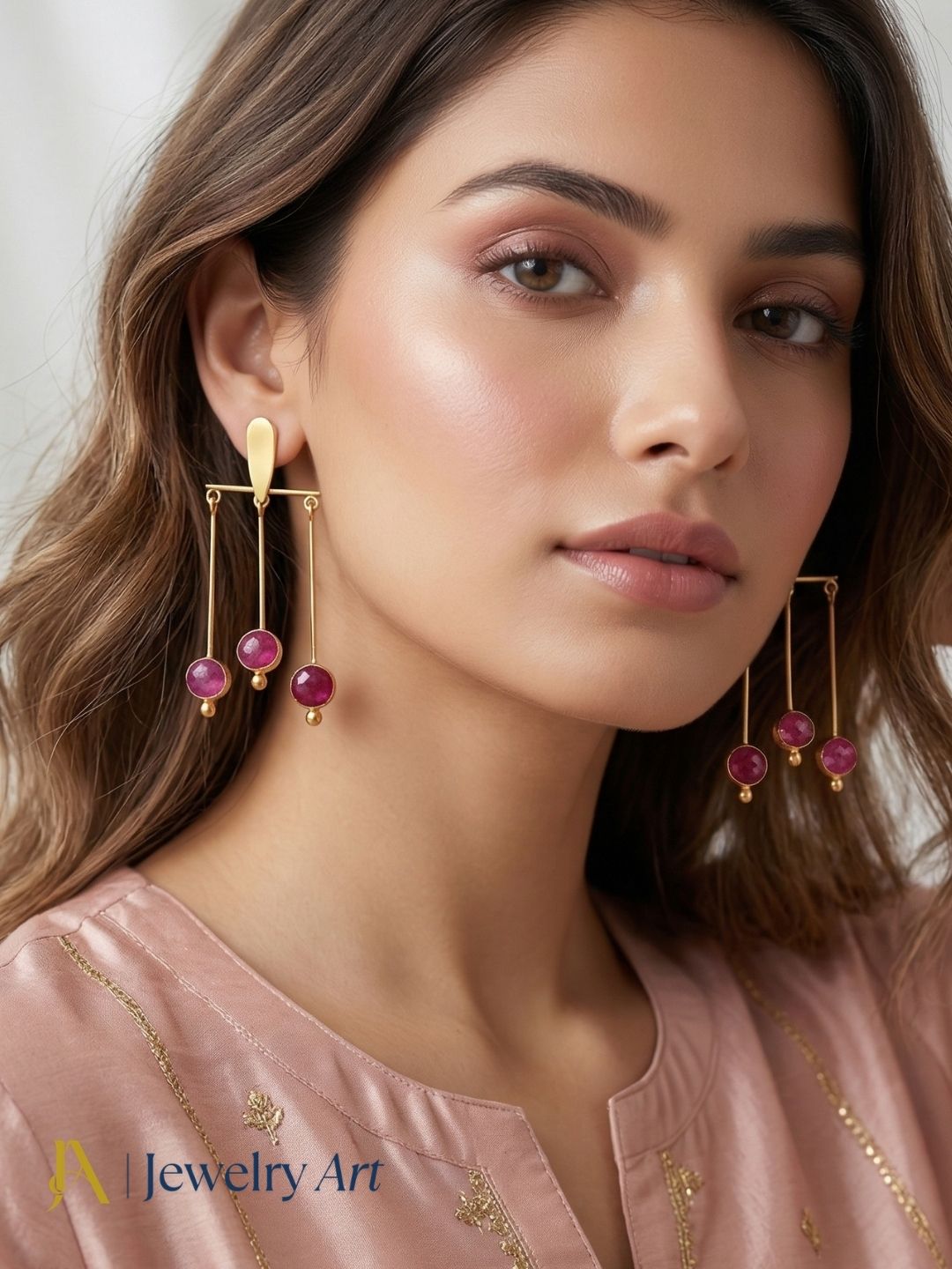 Unique gold plated earrings with red Hathipara stone strong color presence
