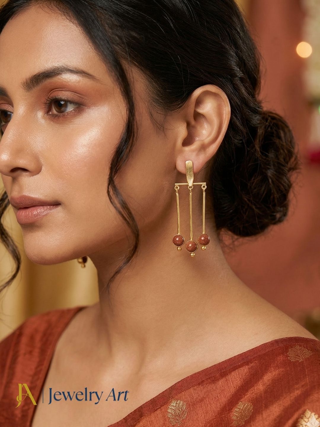 Designer gold plated earrings with  sun sitara accents and glossy light reflection
