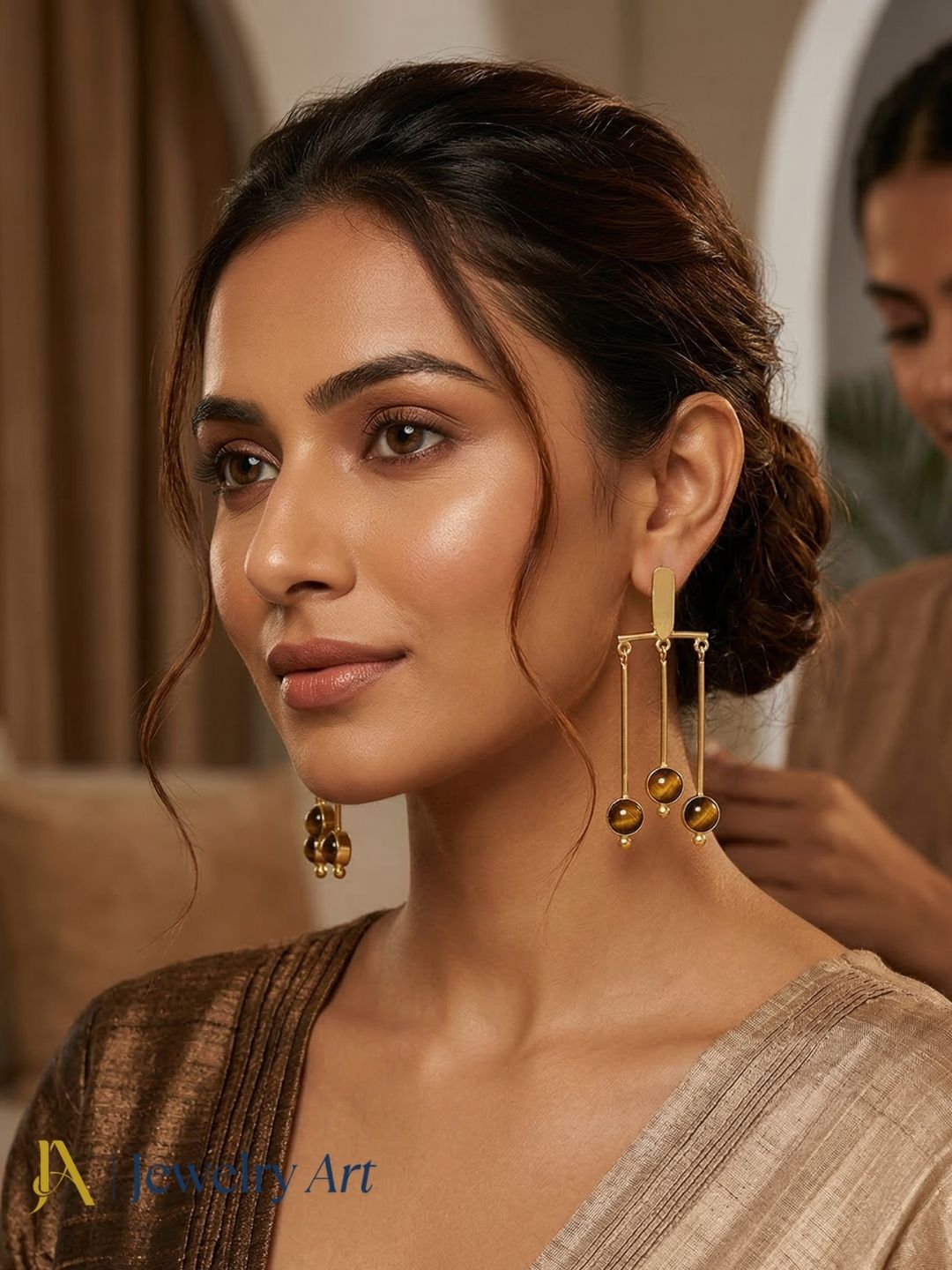 Modern gold finish dangling earrings with tiger eye stone statement look
