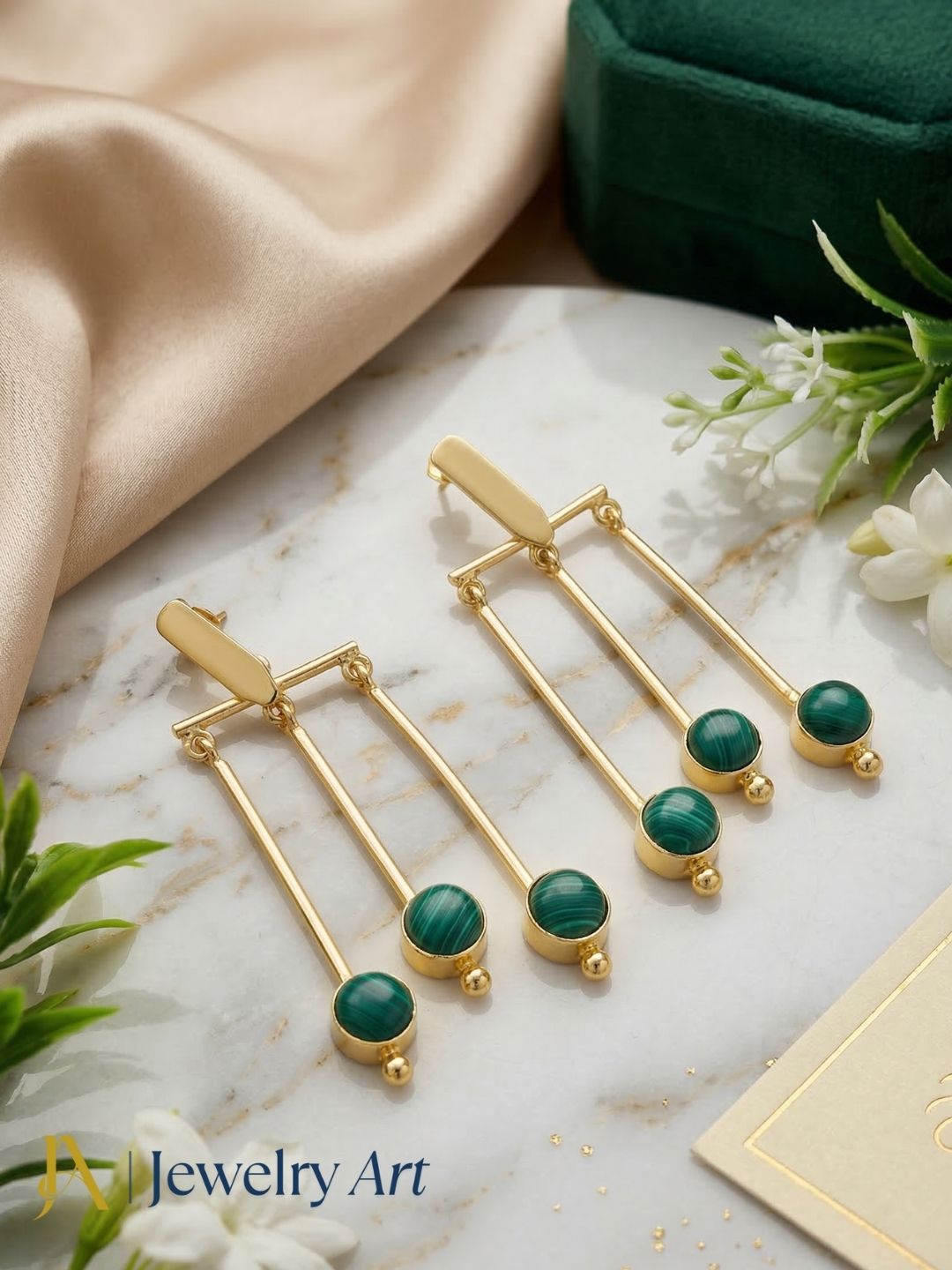 Elegant gold plated dangle earrings featuring synthetic malachite stone designer hanging earrings.
