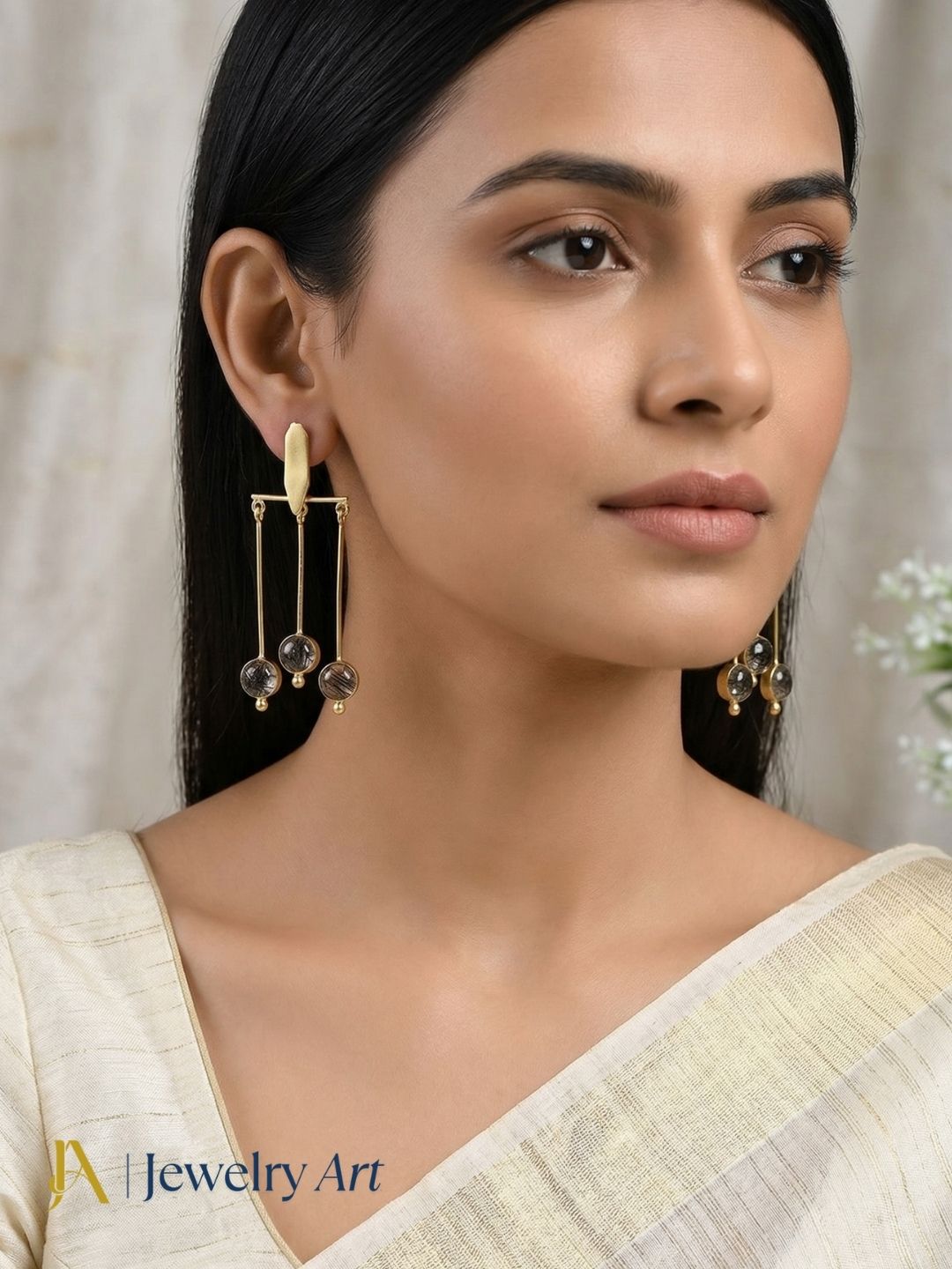 Elegant dangle earrings with black rutile quartz stone and natural textured patterns

