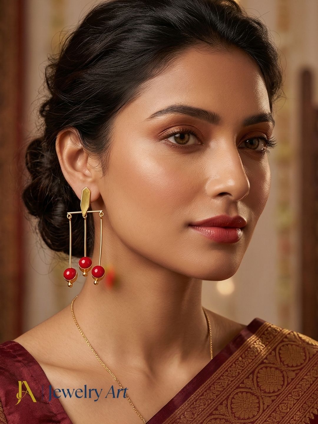 Gold tone drop earrings with red glass stone showcasing bright ruby red sparkle