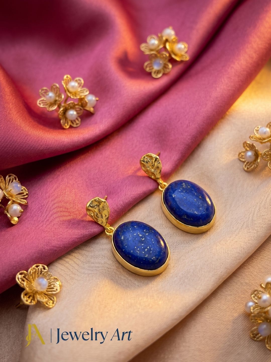Lightweight lapis gemstone earrings displayed with decorative props
