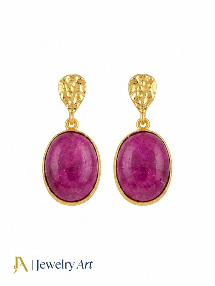Amazing gold plated red Hathipara gemstone earrings displayed on a pure white background
