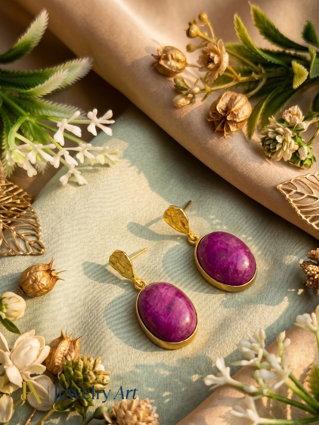 Artistic display of handcrafted red Hathipara stone earrings for women
