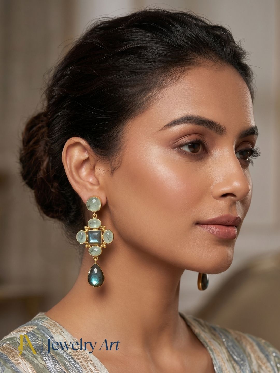 Close-up of model wearing handcrafted labradorite and prehnite gemstone earrings
