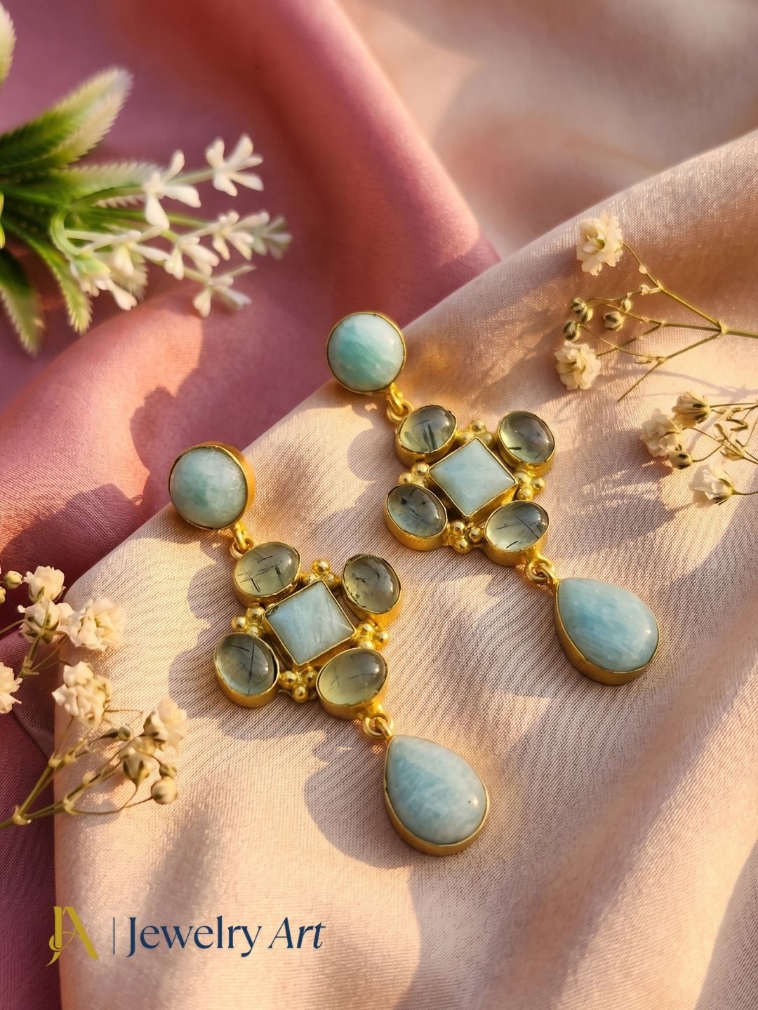 Luxury gemstone earrings featured in decorative product photography
