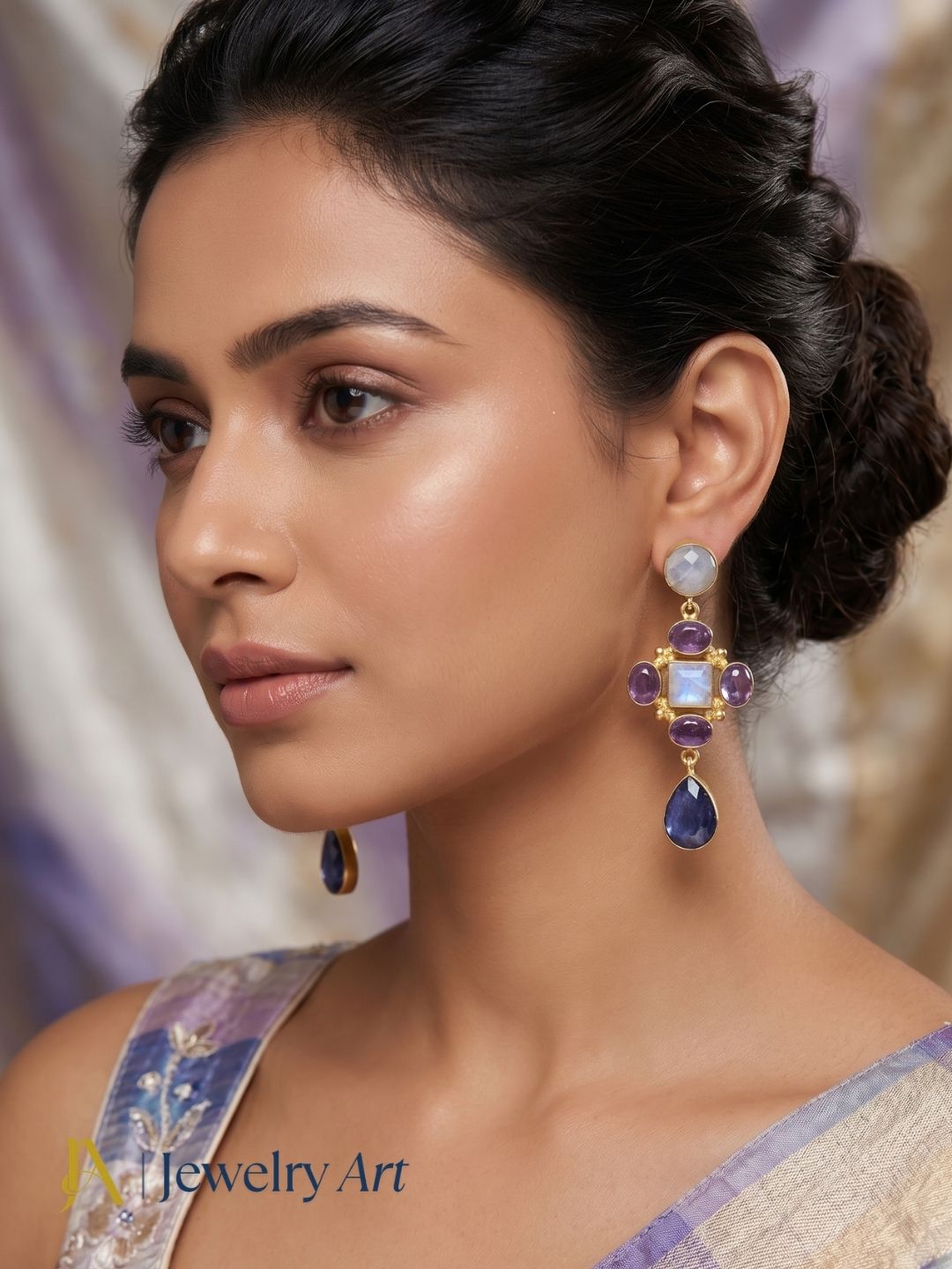 Fashion model wearing designer multi gemstone gold plated drop earrings
