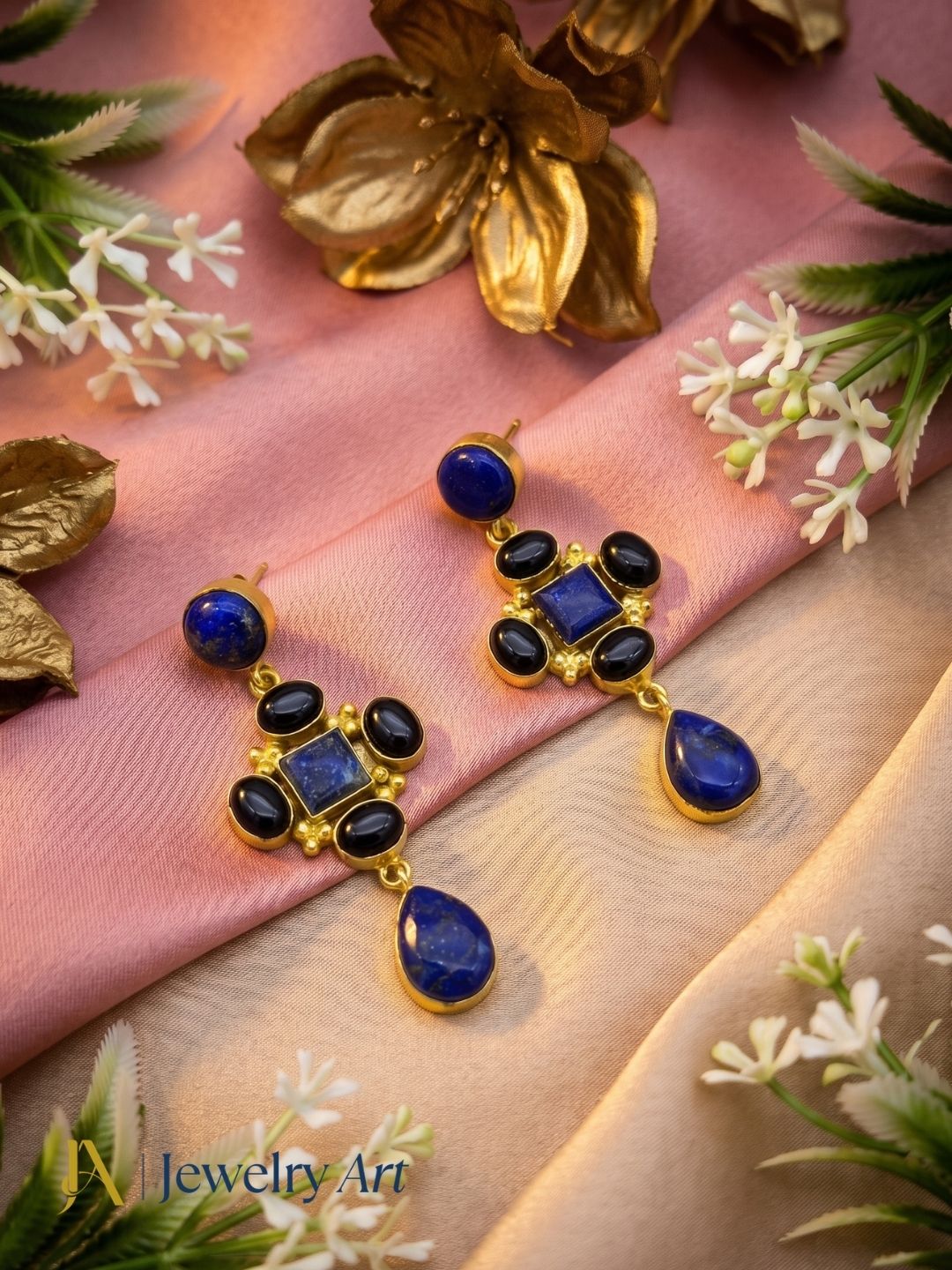 Decorative setup showcasing lapis black onyx gold plated earrings
