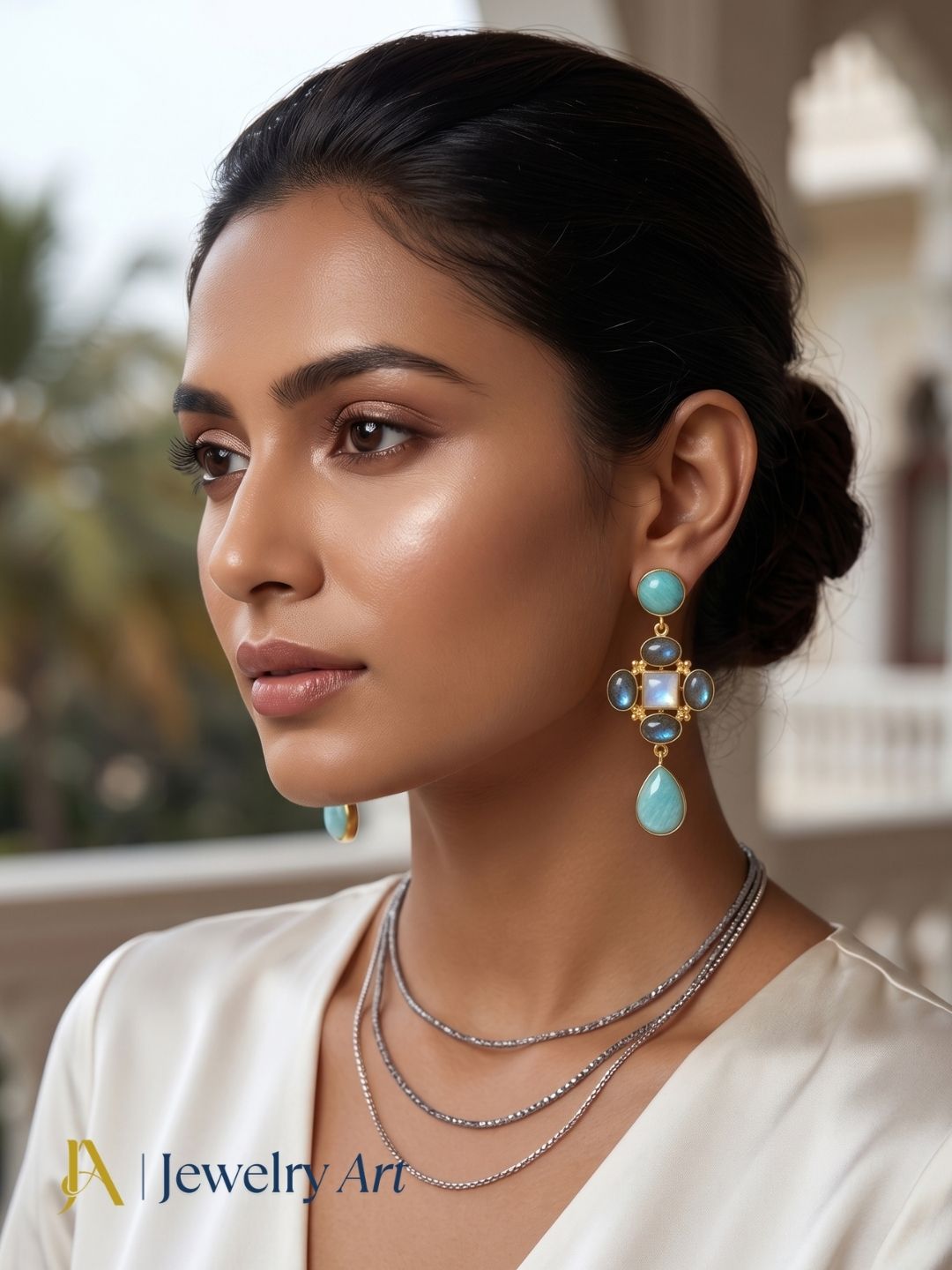 Model wearing lightweight gold plated semi-precious gemstone earrings
