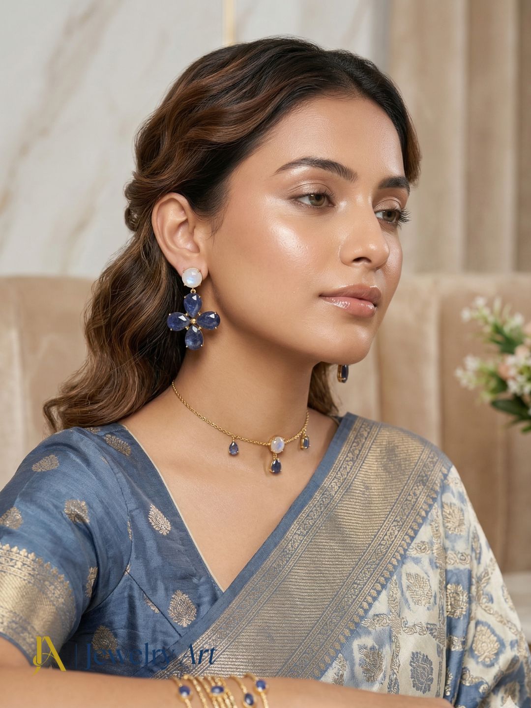 "Lightweight gold plated earrings with white rainbow and blue Hathipara gemstone drop design
"
