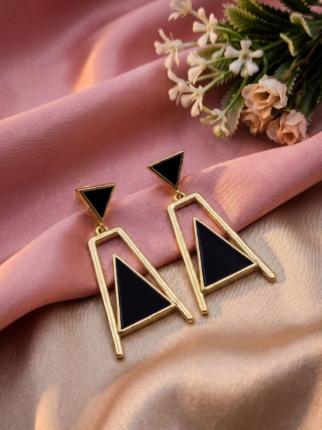 Gold plated aquamarine geometric dangle earrings styled with soft spring florals  
