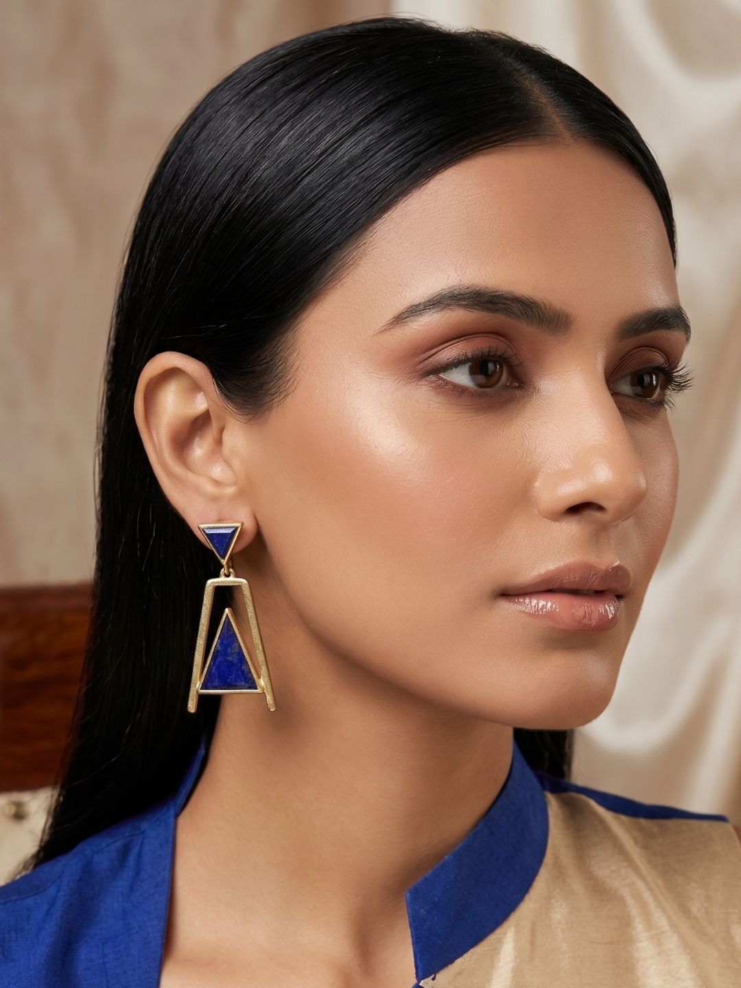 Woman showcasing lightweight handcrafted lapis dangle earrings
