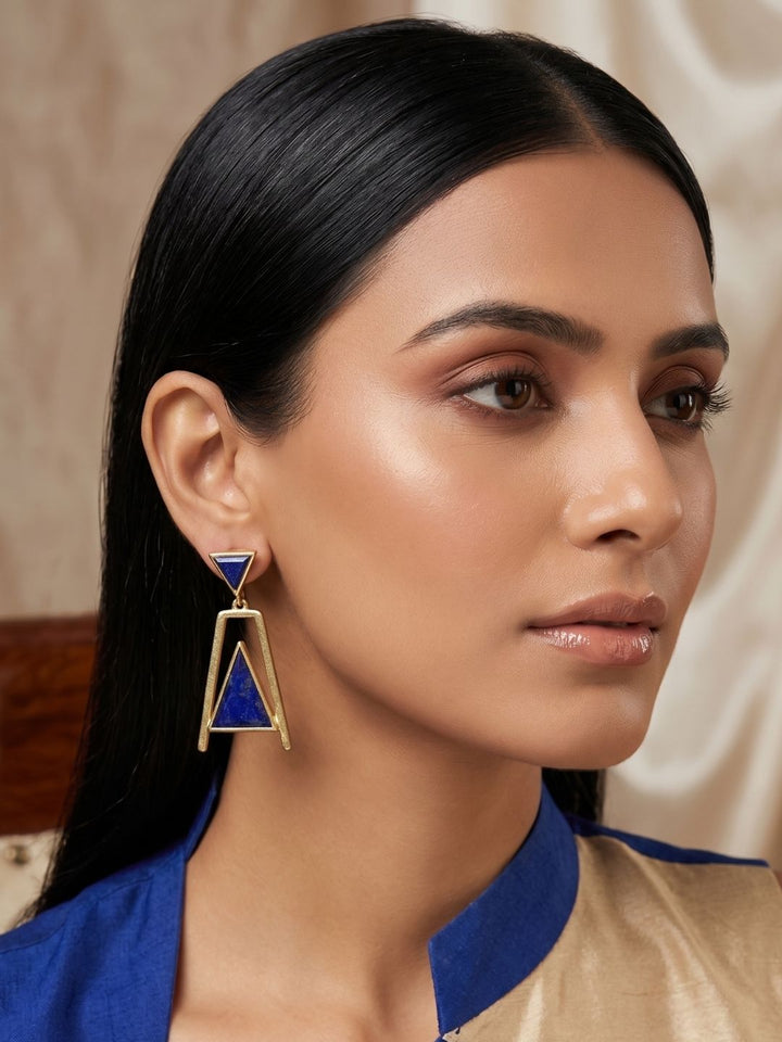 Woman showcasing lightweight handcrafted lapis dangle earrings
