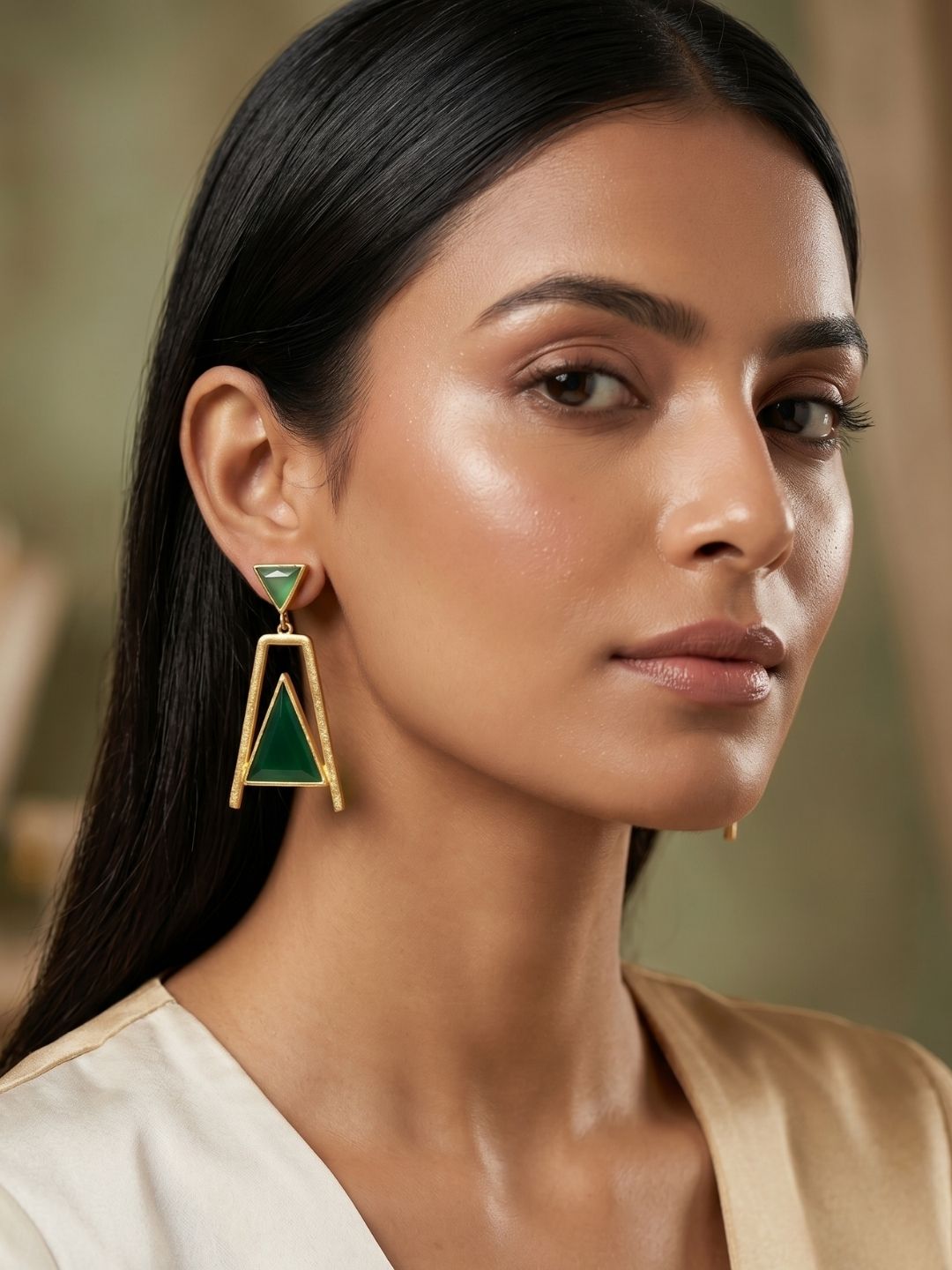 Woman styling gold plated green chalcedony and green onyx designer earrings

