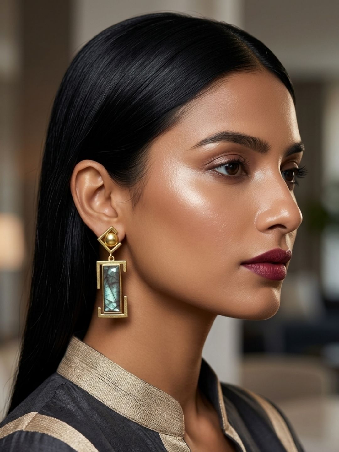 Model wearing premium gold plated labradorite statement earrings
