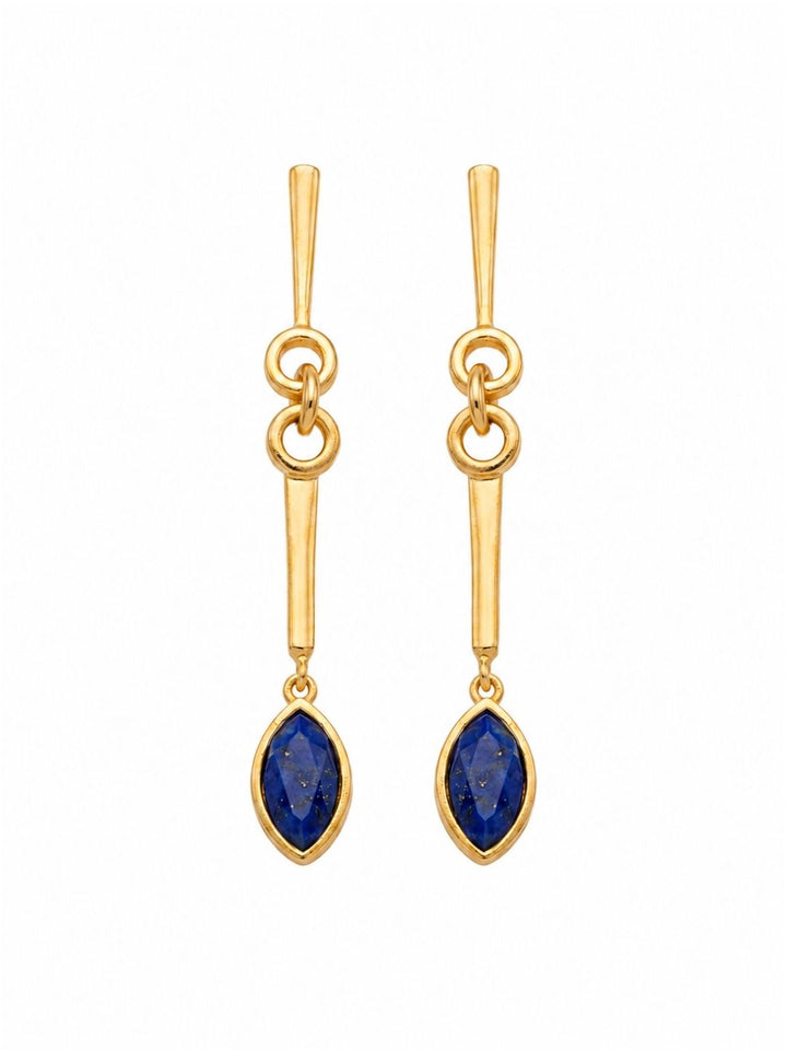 Gold plated long dangle earrings with natural lapis stones isolated on a white background.
