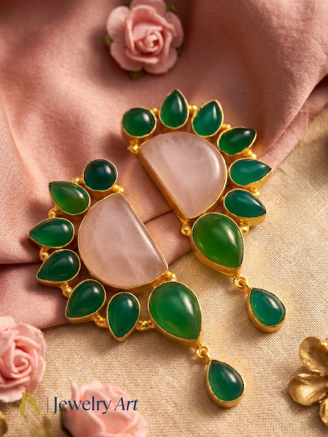 Woman wearing handmade gold plated multi gemstone rose quartz green onyx drop earrings at party
