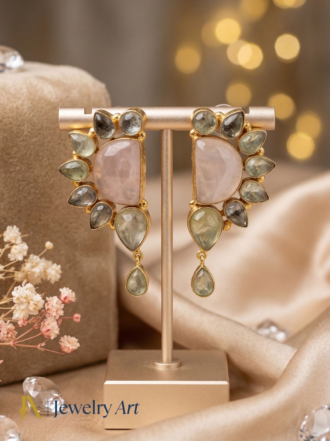  natural rose quartz pink stone and pale green prehnite gemstone in handmade gold plated dangle earring on display stand
