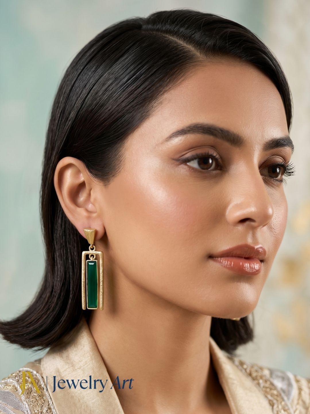 Fashion model showcasing handcrafted aquamarine dangle earrings with premium designer appeal.
